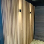 Premium Ipe hardwood slatted fence in barcode pattern featuring a mix of 5, 7, and 9 cm wide slats with hidden clip fasteners