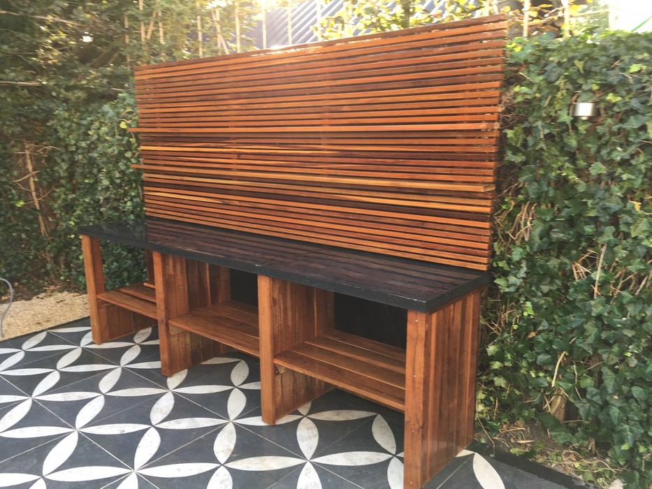 Luxury custom outdoor kitchen made of Ipé hardwood slats and beams