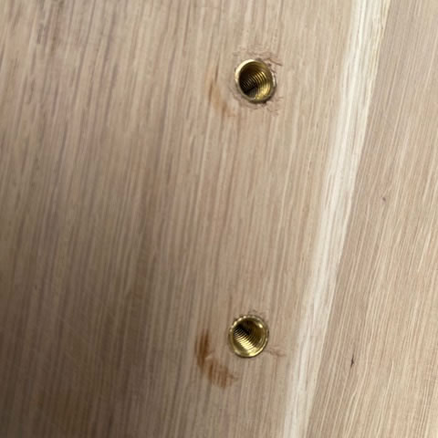 Table tops are fitted with a metal bushing